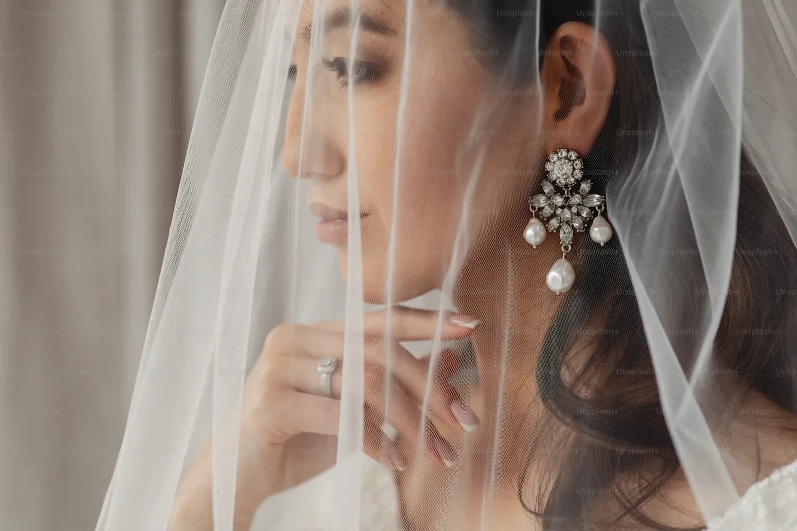 Bride having hair styled with fresh flowers