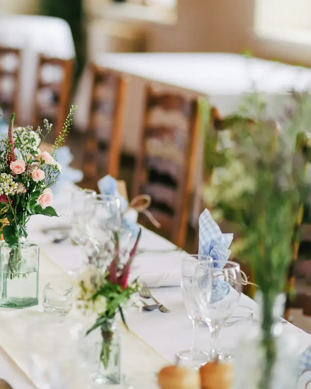 Wedding table decorated with fresh florals and glassware